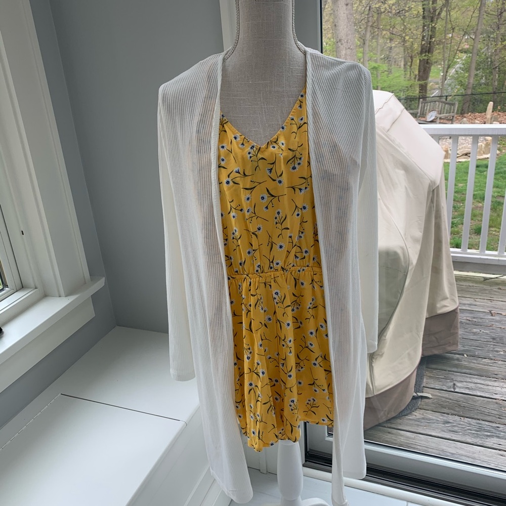 Yellow floral romper with white ribbed cardigan